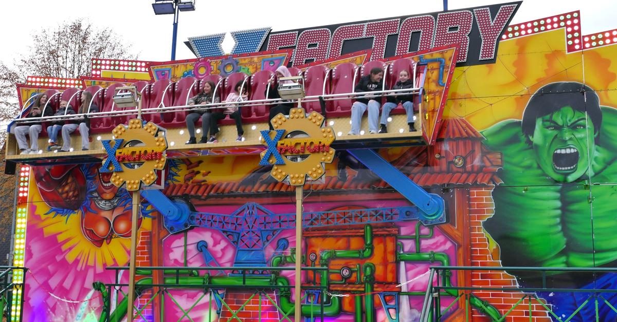 Colorful hustle and bustle and a large amusement park at the St ...
