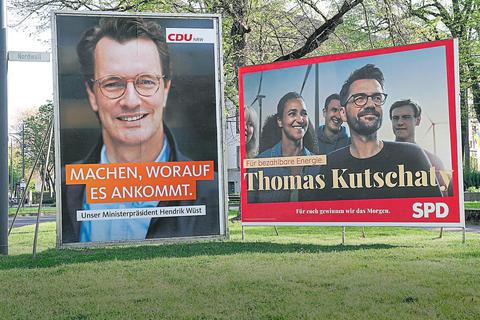 Plakate vonCDU und SPD inmittenvon Grün.Foto: dpa/Picture-Alliance 